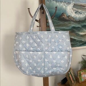 Vintage and handmade quilted blue tote with floral design